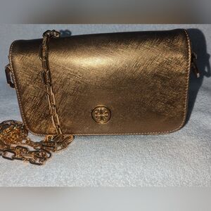 Tory Burch good metallic crossbody bag.